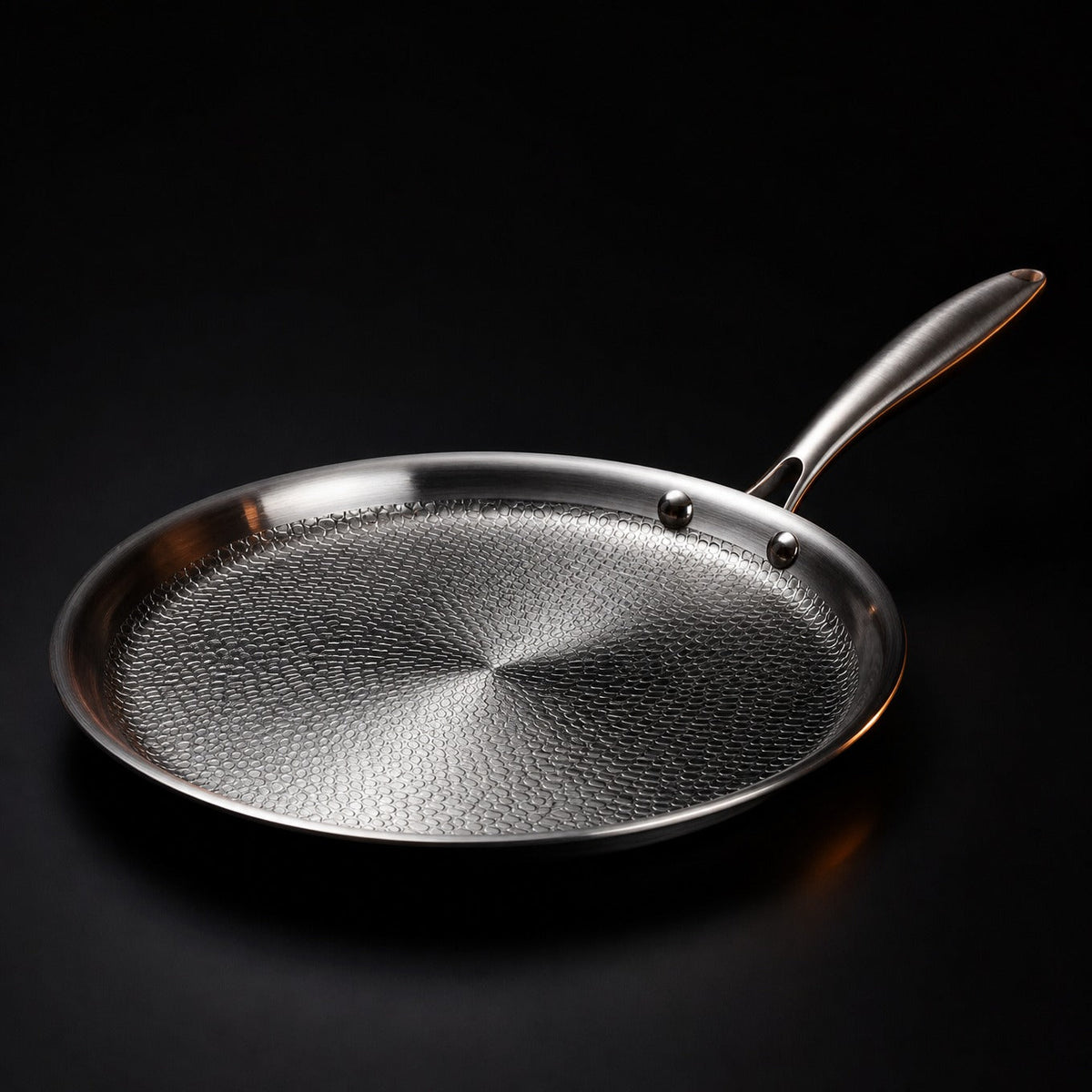 Hand-hammered flat titanium crêpe pan cooking a crêpe, PFAS-free cookware by Okura